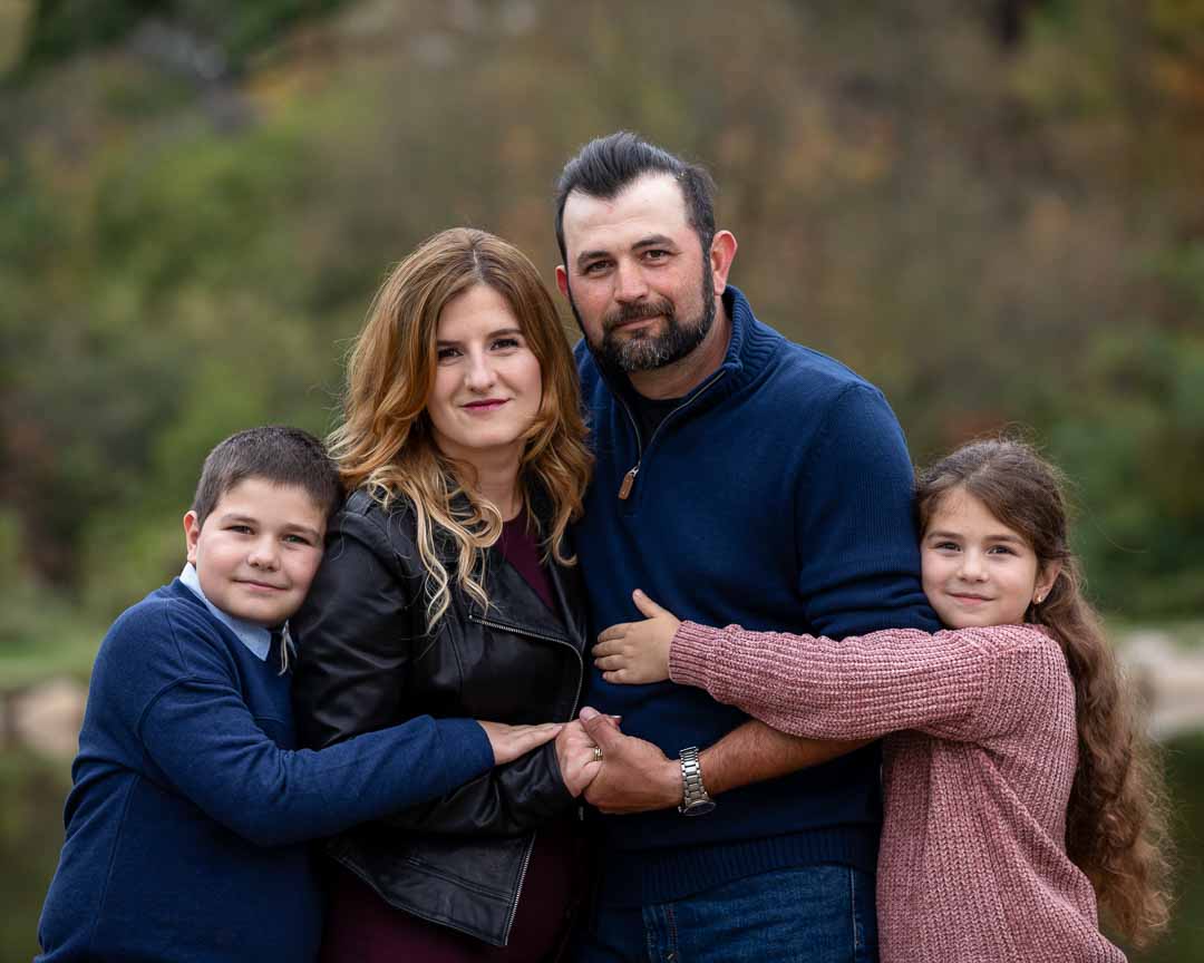 Fall family portrait with kids and parents in West Bloomfield, Michigan by Olga Gamburg Photography