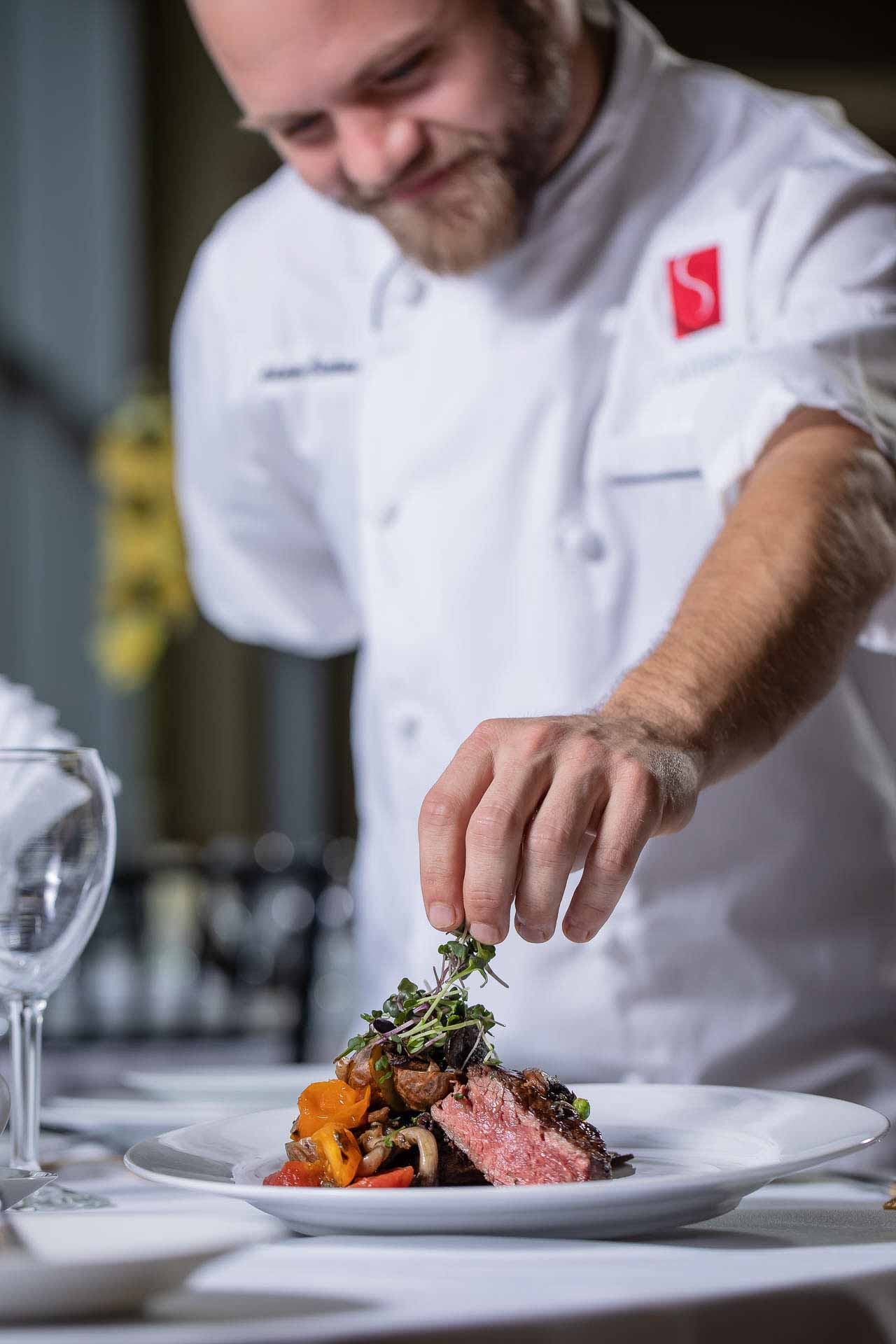 Olga Gamburg Photography Chef Garnishing Steak Restaurant Food Commercial Product Photography Detroit, Michigan